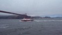 Pilot boat heading out under the Golden Gate Bridge